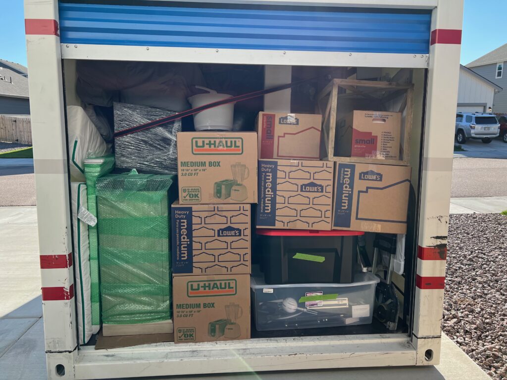 Pod packed with boxes and belonging